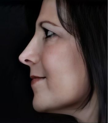 Profile view of a woman with dark hair.